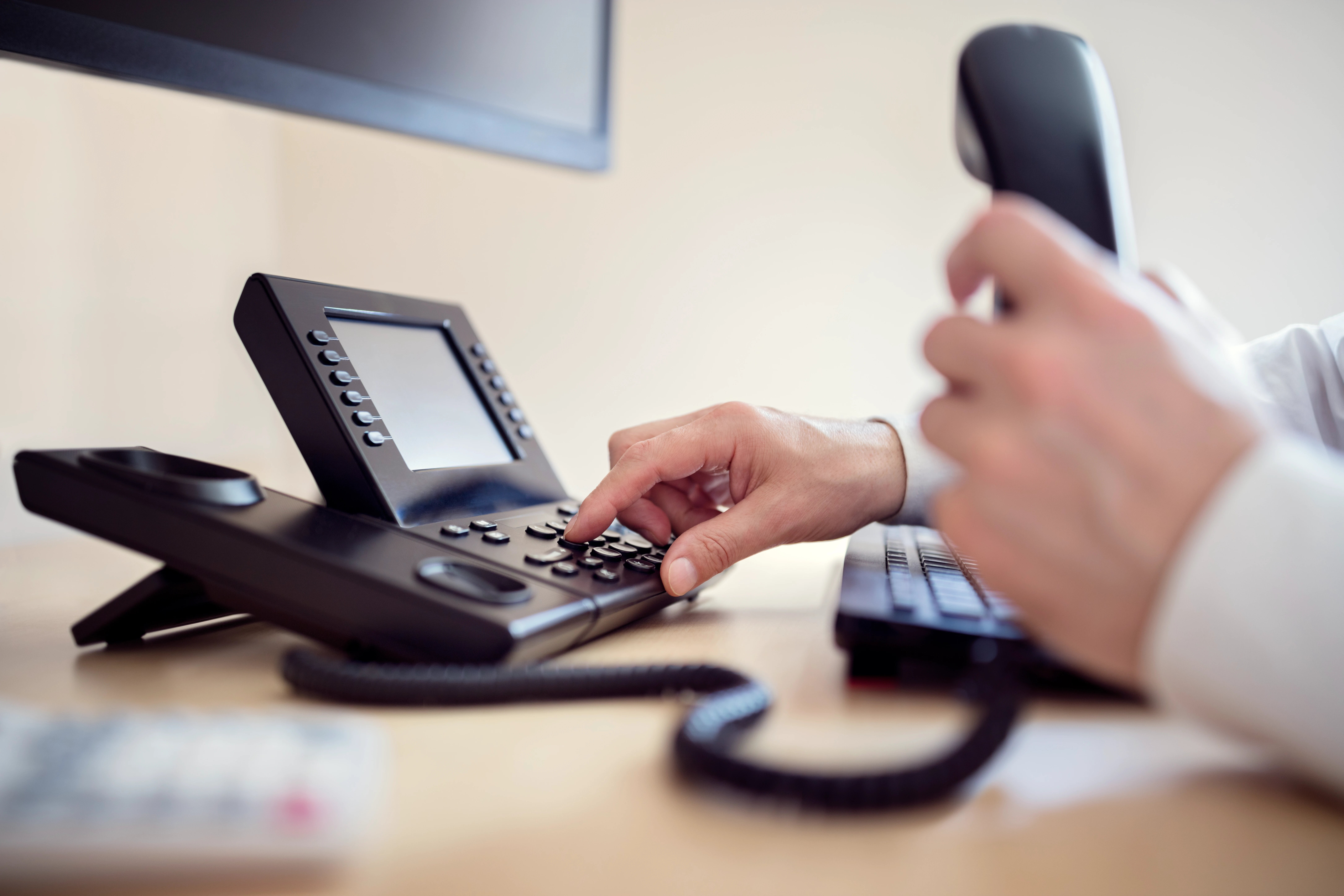business-professional-dials-landline-telephone-at-2026-01-05-01-09-02-utc