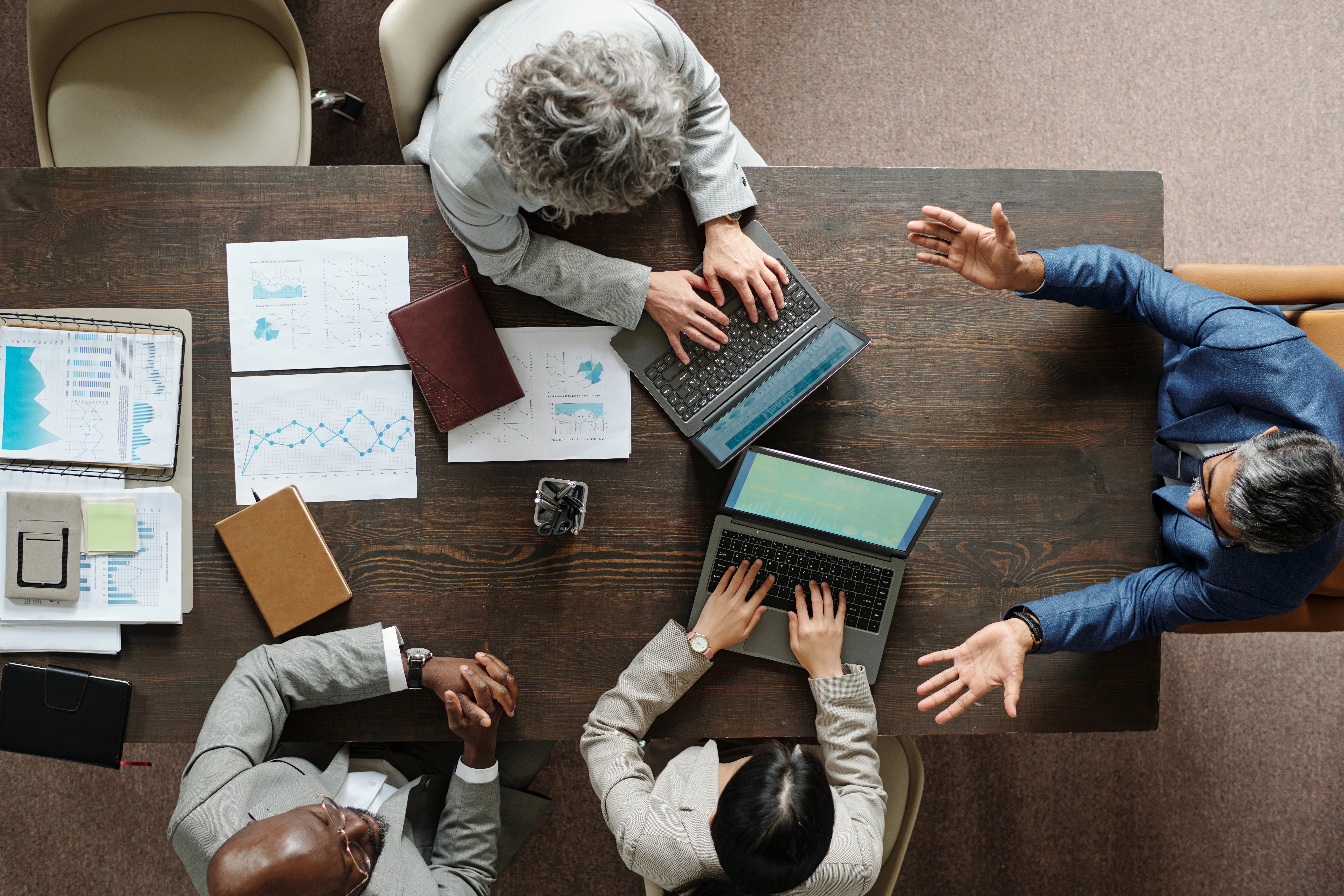 diverse-middle-aged-business-team-collaborating-du-2026-01-09-12-05-04-utc