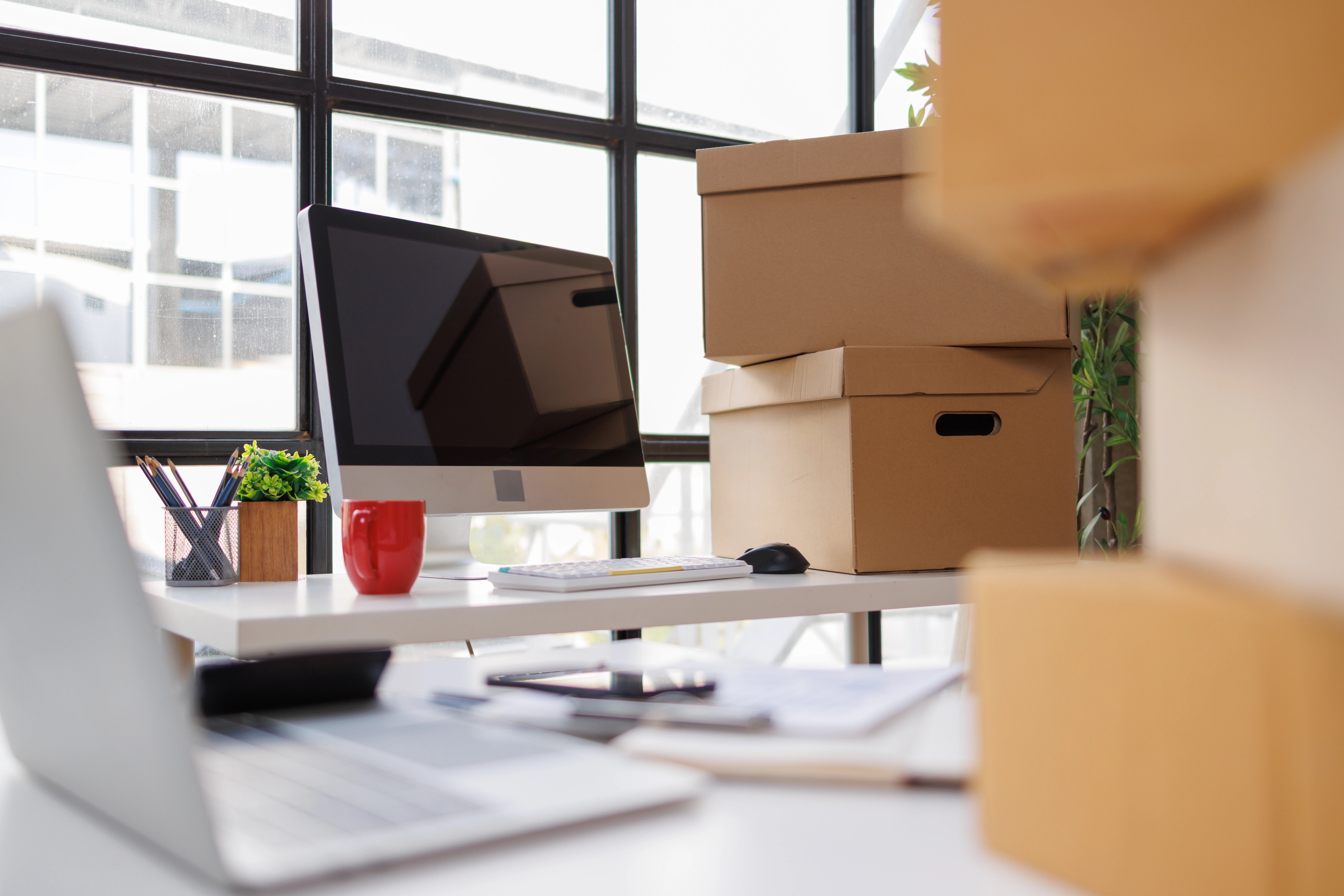 home-office-workspace-with-stacked-cardboard-deliv-2026-06-01-19-44-11-utc