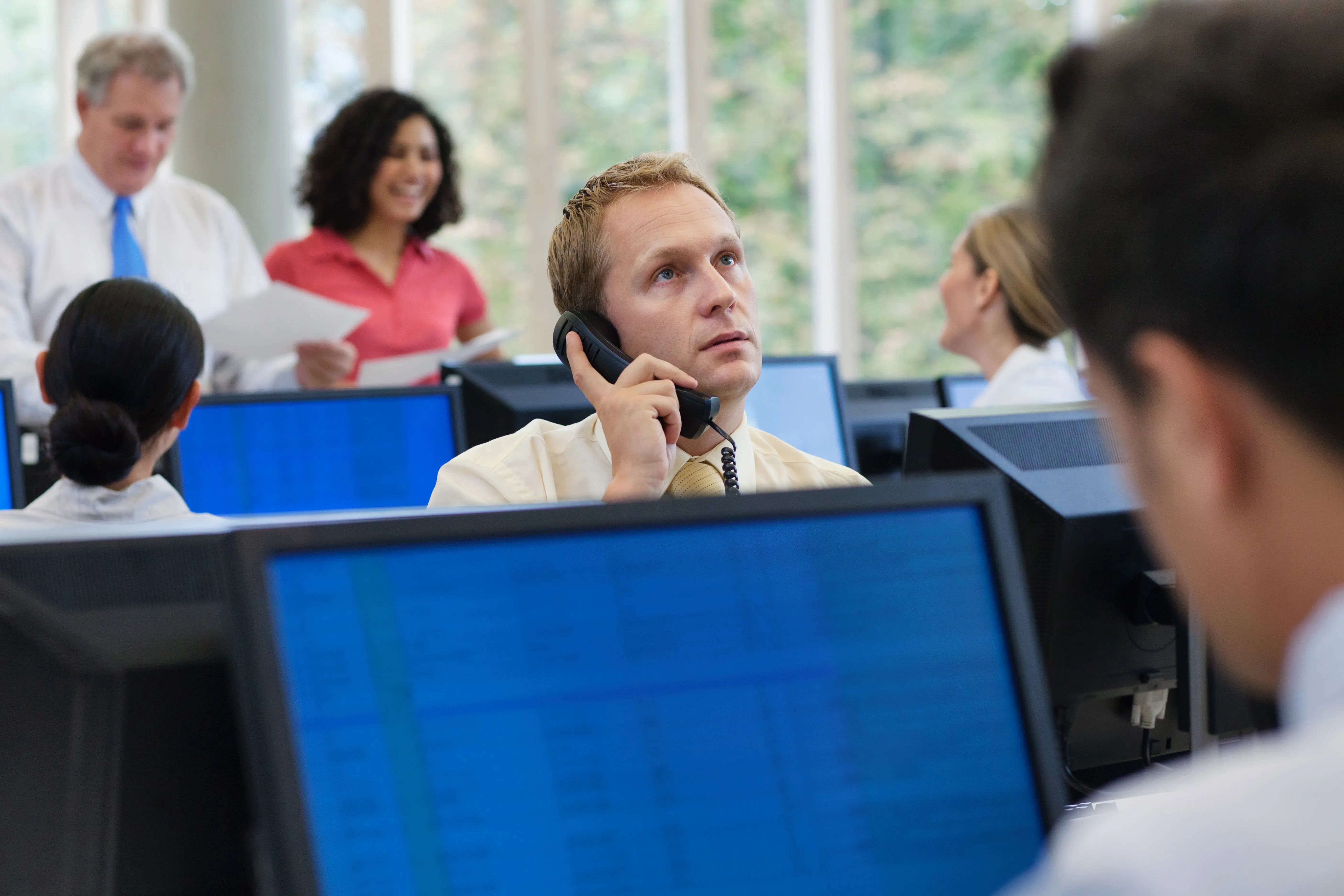 office-worker-using-telephone-in-office-2026-03-25-04-42-10-utc