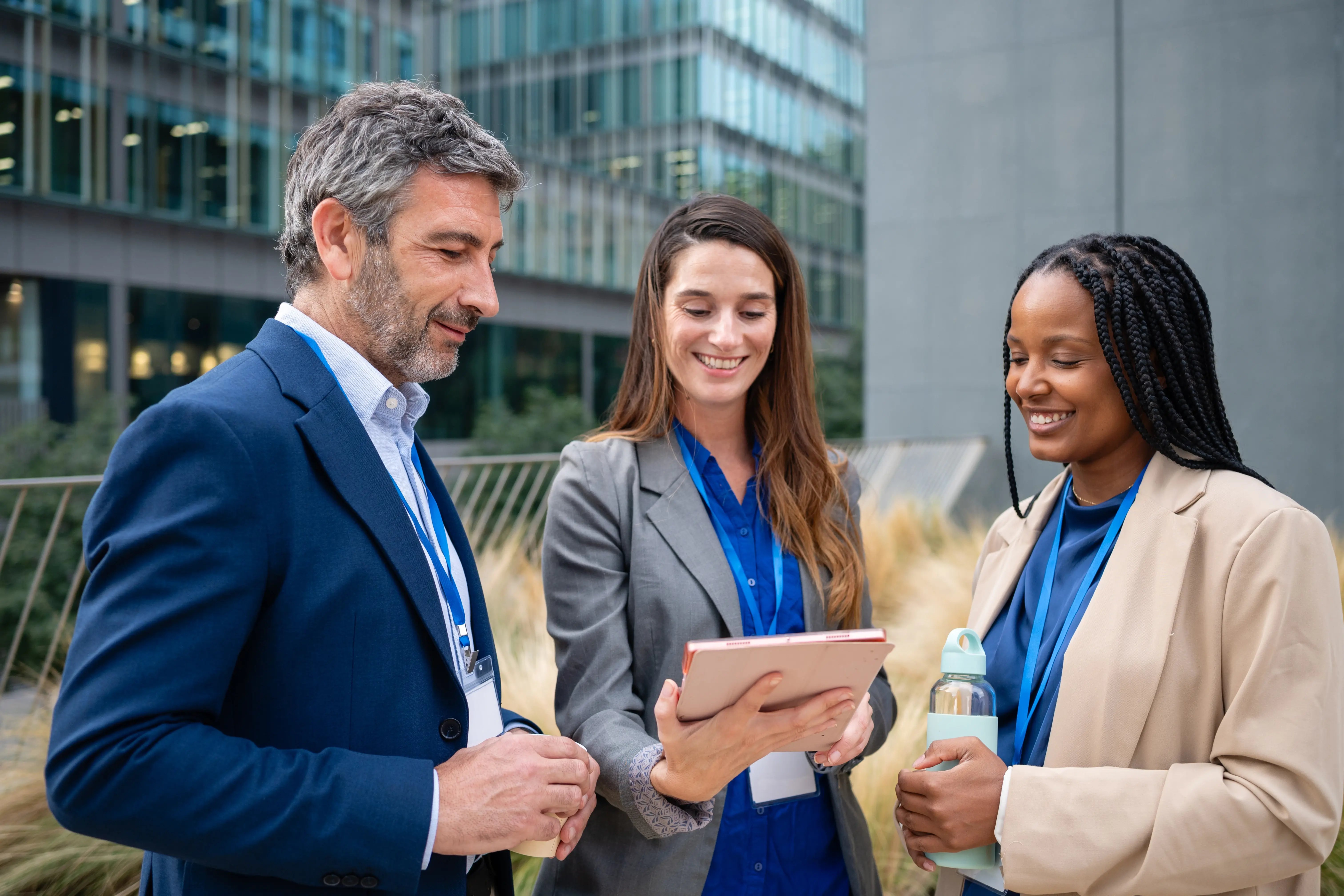 smiling-business-professionals-discussing-work-on-2026-06-23-15-58-42-utc