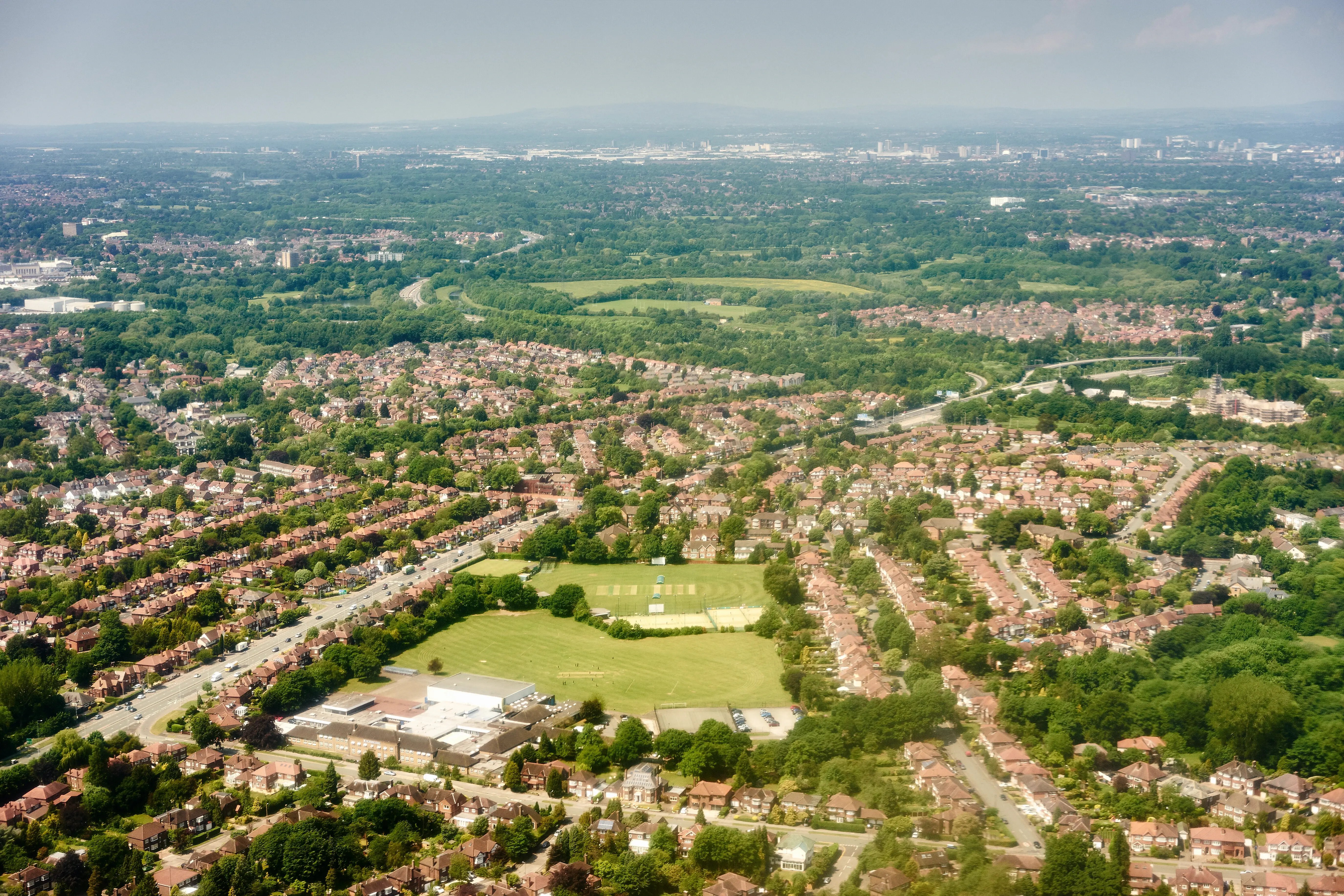 extensive-suburban-landscape-with-green-spaces-and-2026-03-25-00-58-19-utc