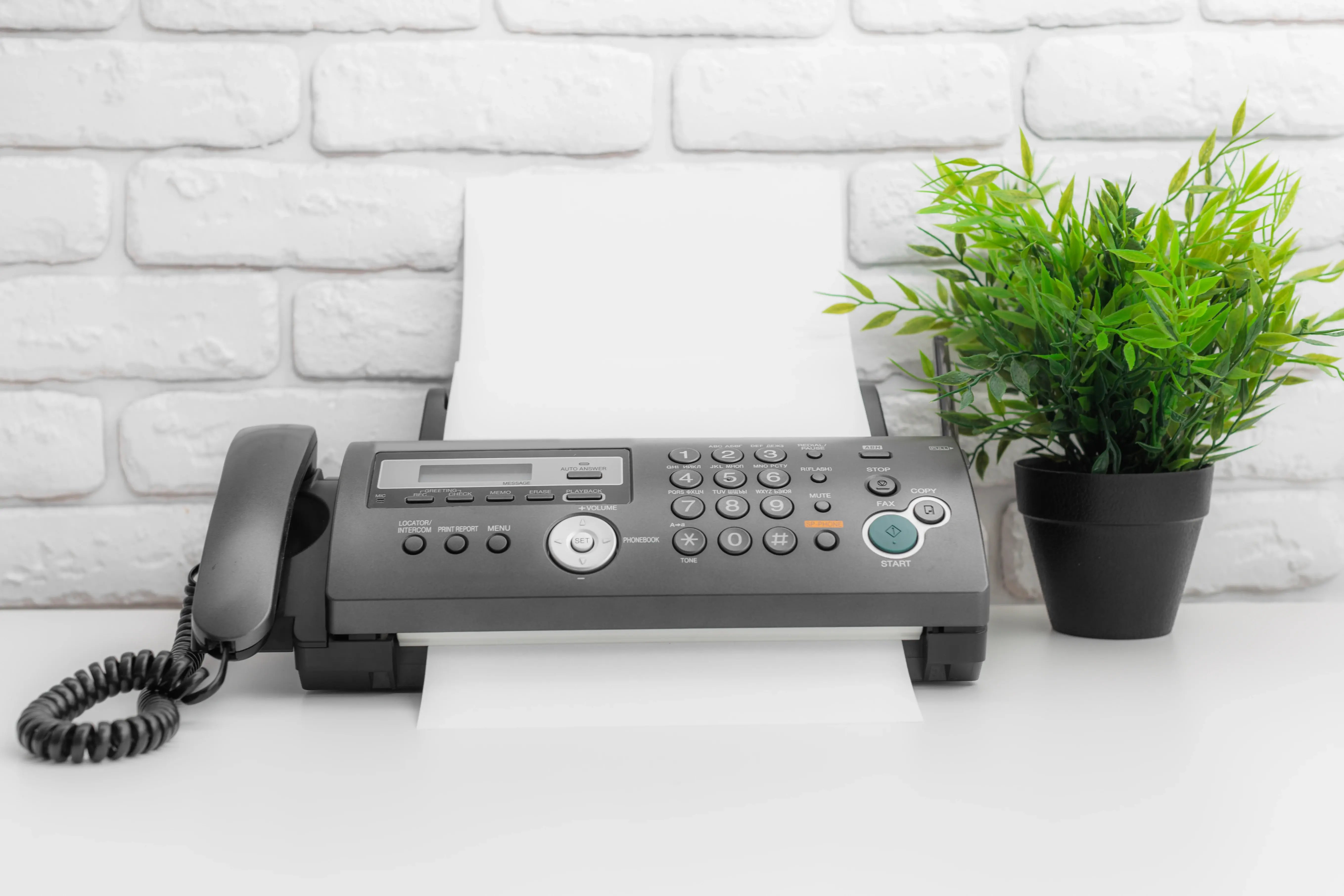 fax-machine-office-equipment-on-white-table-2026-01-09-00-01-46-utc